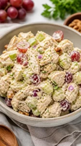 Delicious chicken salad served in a bowl with fresh ingredients and herbs